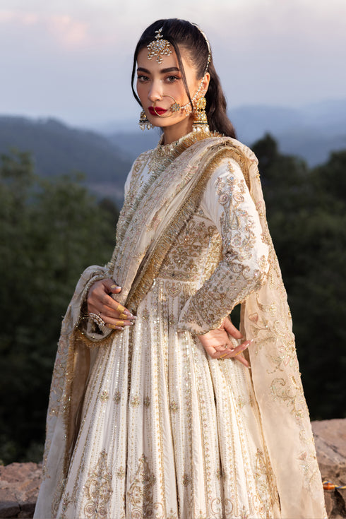 Detailed shot of Naqshi Fasana heavy jaal border embroidered with mirror work, line motifs, kiran lace and crystal thread accents along frock hem.